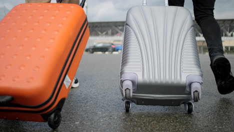 people walking with luggage at an airport