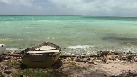 Small-boat-pulled-ashore-on-a-beach-in-Fanning-Island,-Kiribati