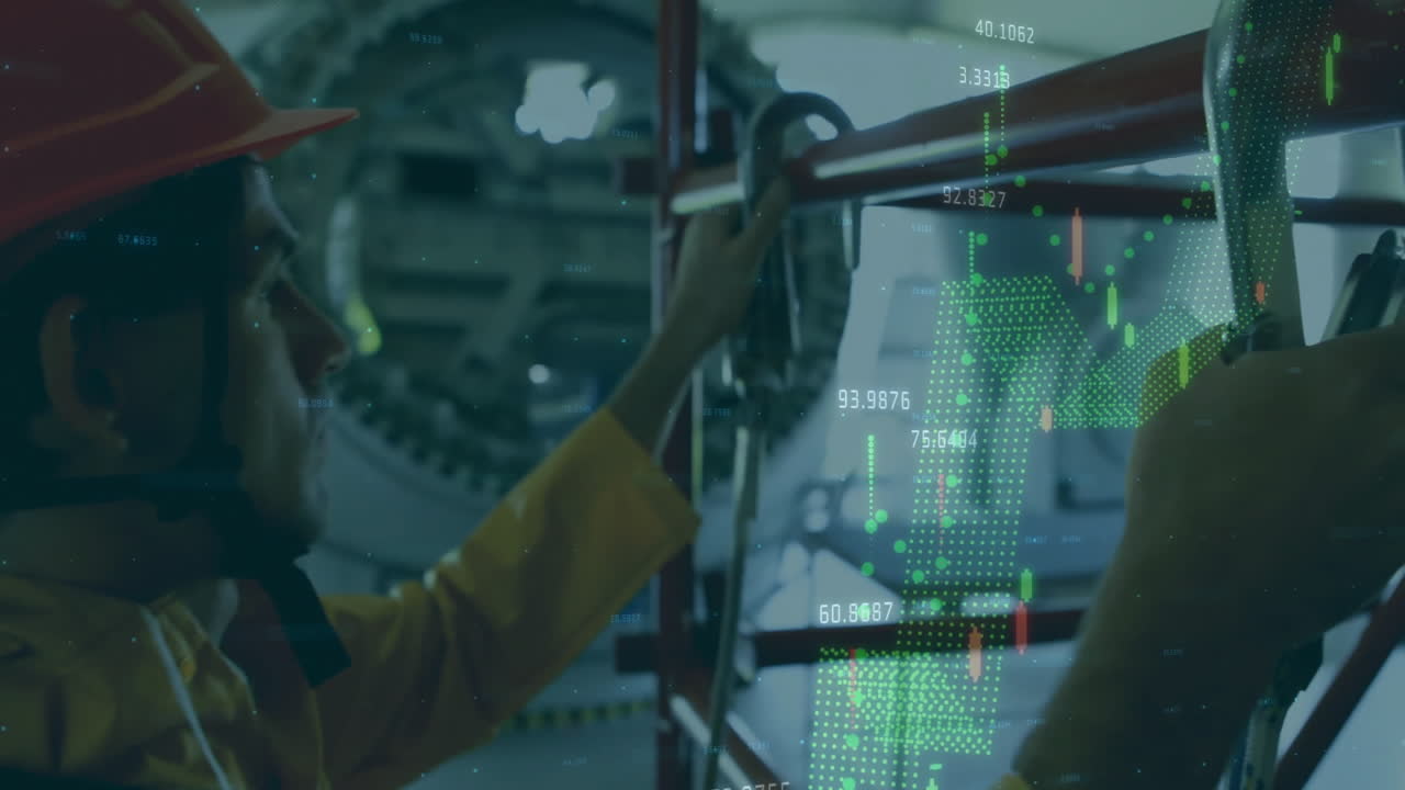 Man wearing orange hard hat adjusting metal pipes in factory while green candlestick charts flowing