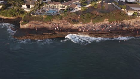 observing a surfer at sunset, surfing along china walls