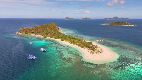 aerial perspective of manlihan island, a paradise with tranquil watres, located in linapacan, philippines