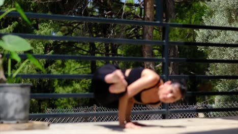 there is a girl doing yoga in the forest bungalow at home