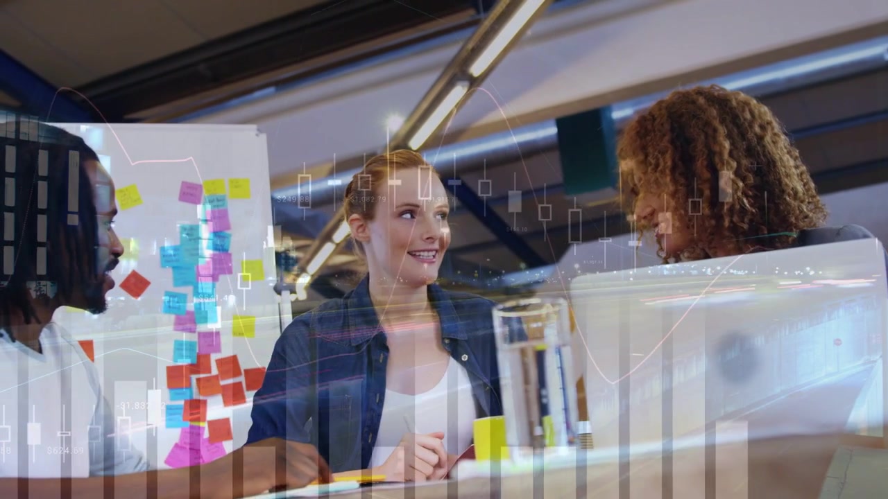 Lead woman leading planning, man joining and pointing sticky notes, biz charts floating over laptop