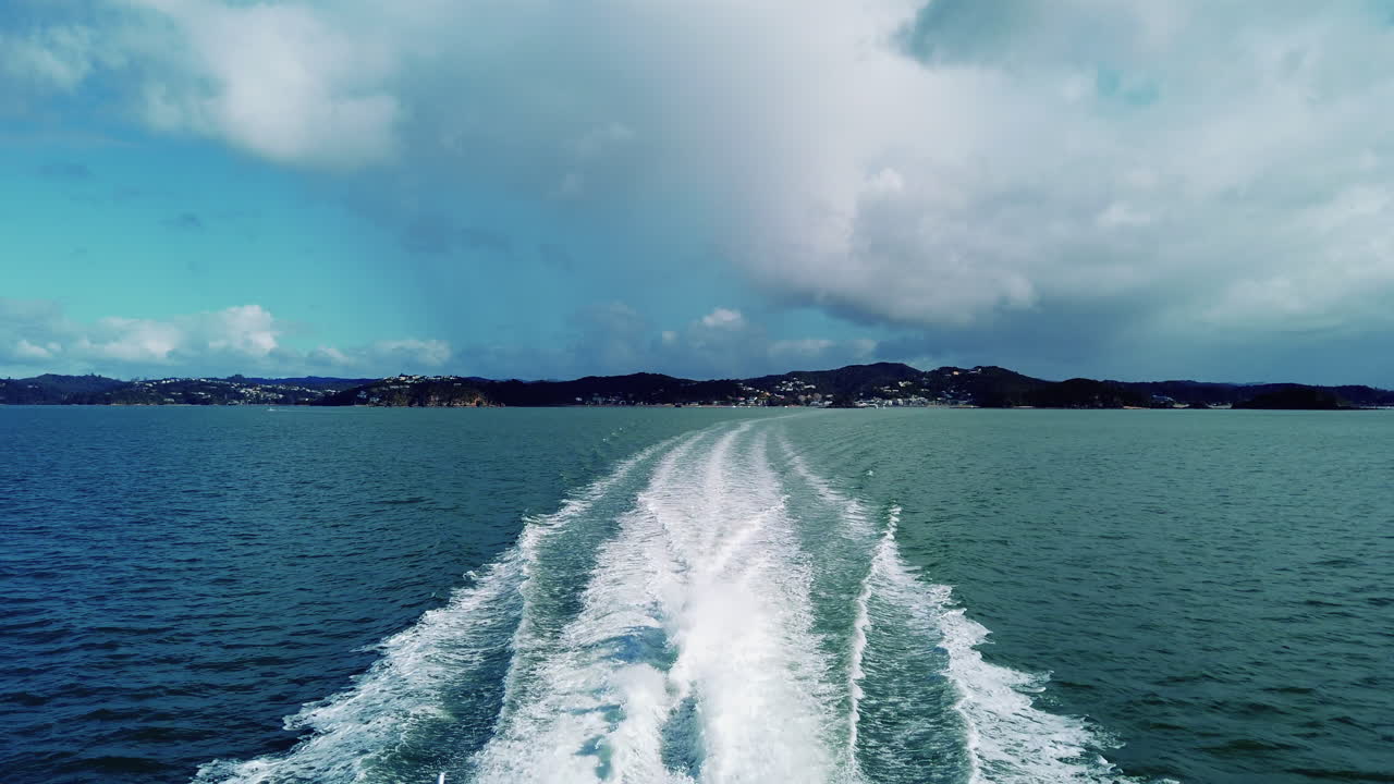 Boat Wake In The Sea In Bay Of Islands, New Zealand On A Brilliant Sunny Day - wide shot