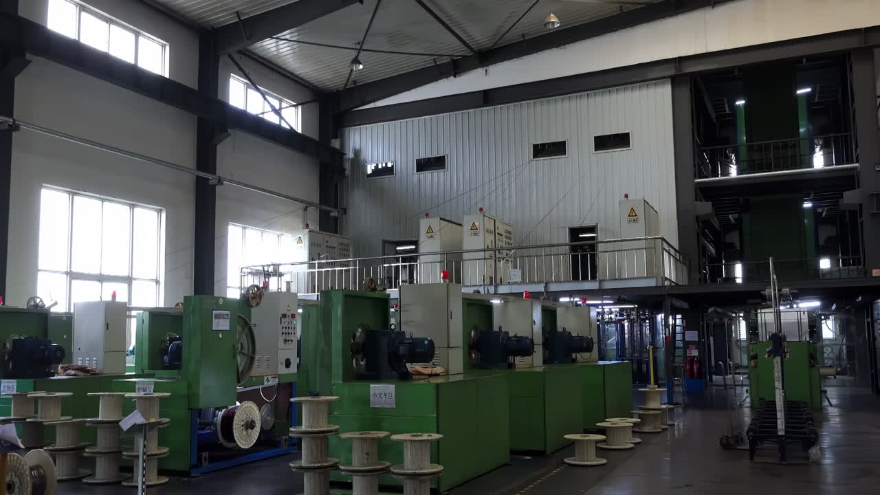 Sunbeam through electrical manufacturing facility setting Industrial Electric Copper Wire Spools Cable Coil manufacturing process Precision, Automation for Components, Cables equipment production