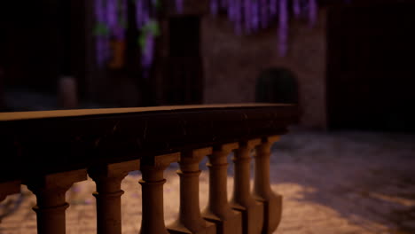 stone railing overlooking a medieval courtyard