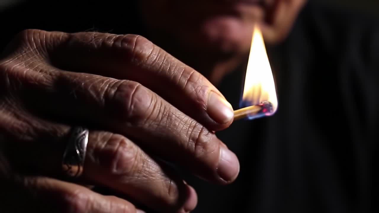 Captivating Moments of Ignition: An Intimate Look at the Art of Lighting a Match with Careful Precision Revealed Through a Series of Frames