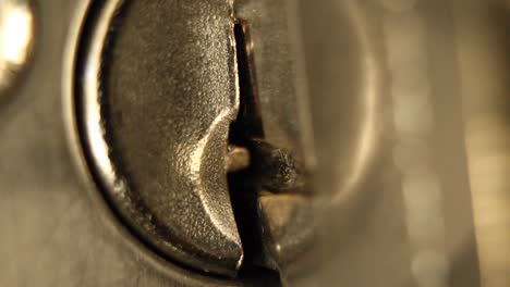 key inserted into deadbolt door lock and removed residential extreme close up