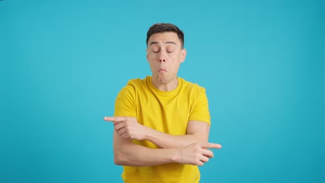man in yellow shirt with confused expression