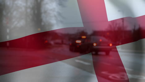 animating england flag over cars driving on rainy street