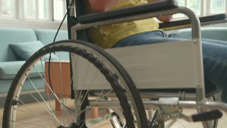 young person using smartphone in wheelchair