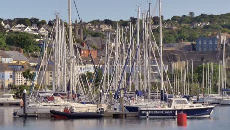 static view of dock piers of howth yacht club, establishing view, sails down