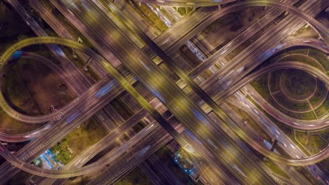 aerial hyperlapse of traffic over big intersection bridges and ring road. 4k aerial view by a drone over big roundabout in bangkok thailand.