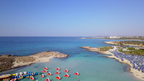 aerial shot of a beautiful sandy beach with a small island