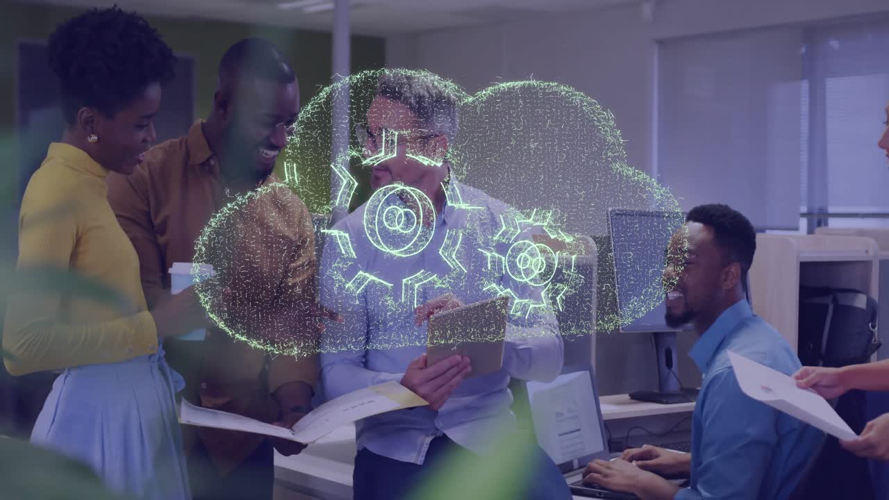 Technology team collaborating in open-plan office, showcasing holographic cloud with gear symbols