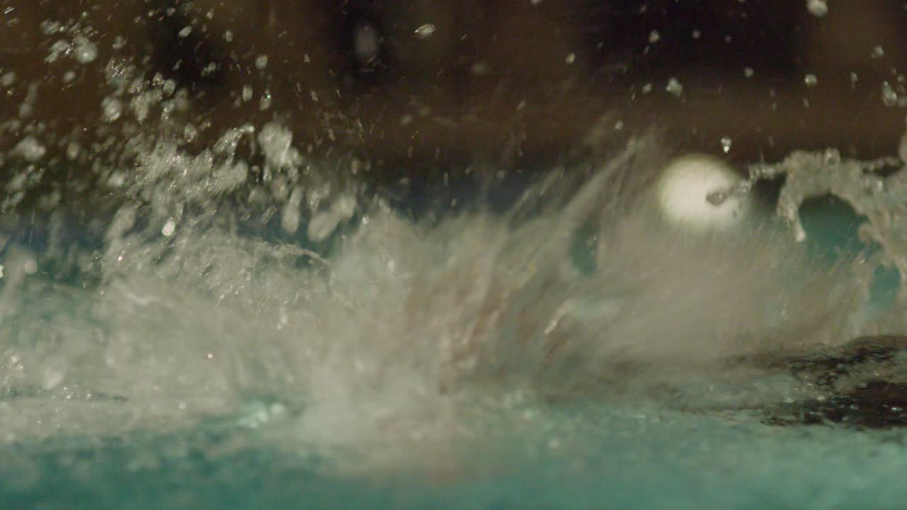 Swimming in a pool at night