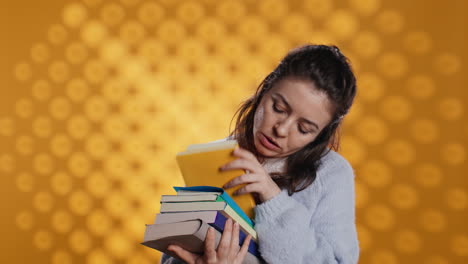 excited woman browsing though pile of books, picking what to read