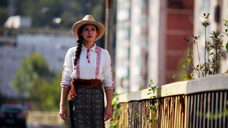 romanian girl walks on the bridge in the central area, resita, romania