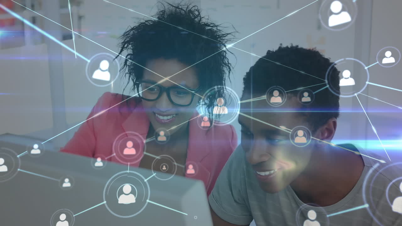 Animation of a couple sitting by a desk over a web of connection in the background.