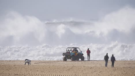 slow motion of a wave break on the beach in nazaré, portugal