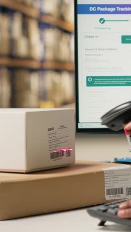 vertical video african american female in hi vis vest scanning barcodes for parcel shipment