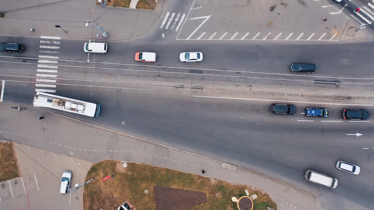 Aerial view of city intersection with cars and traffic