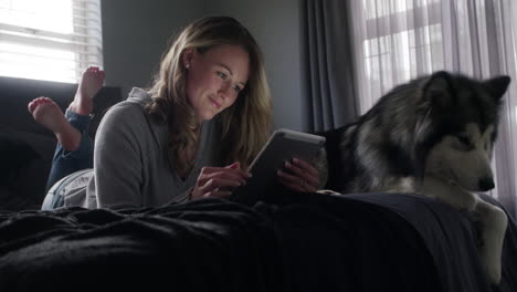 a young woman using a digital tablet