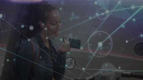 Animation-of-network-of-connections-with-data-over-biracial-woman-using-smartphone