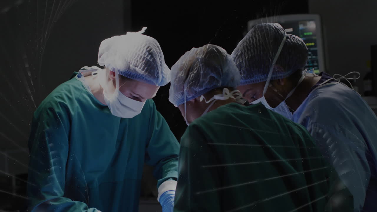 Surgeons performing medical procedure in operating room, focusing on precision work