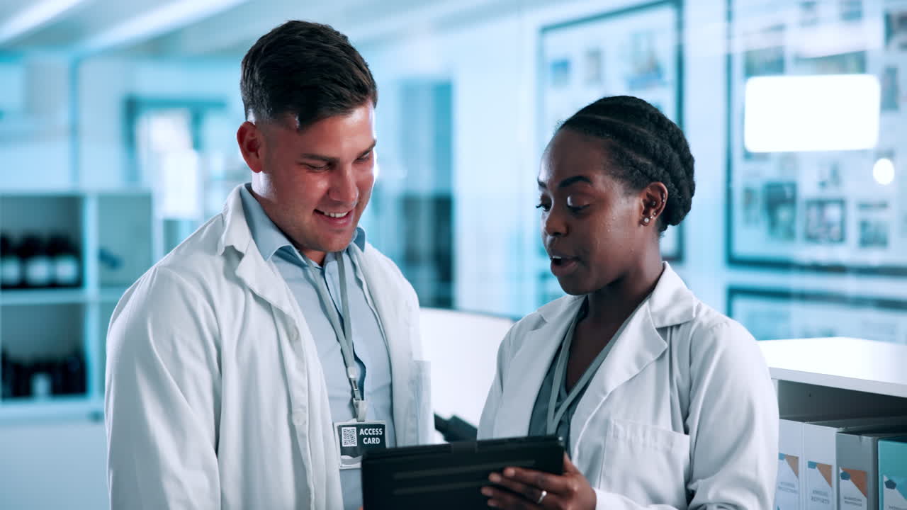 Medical Professionals Discussing on Tablet