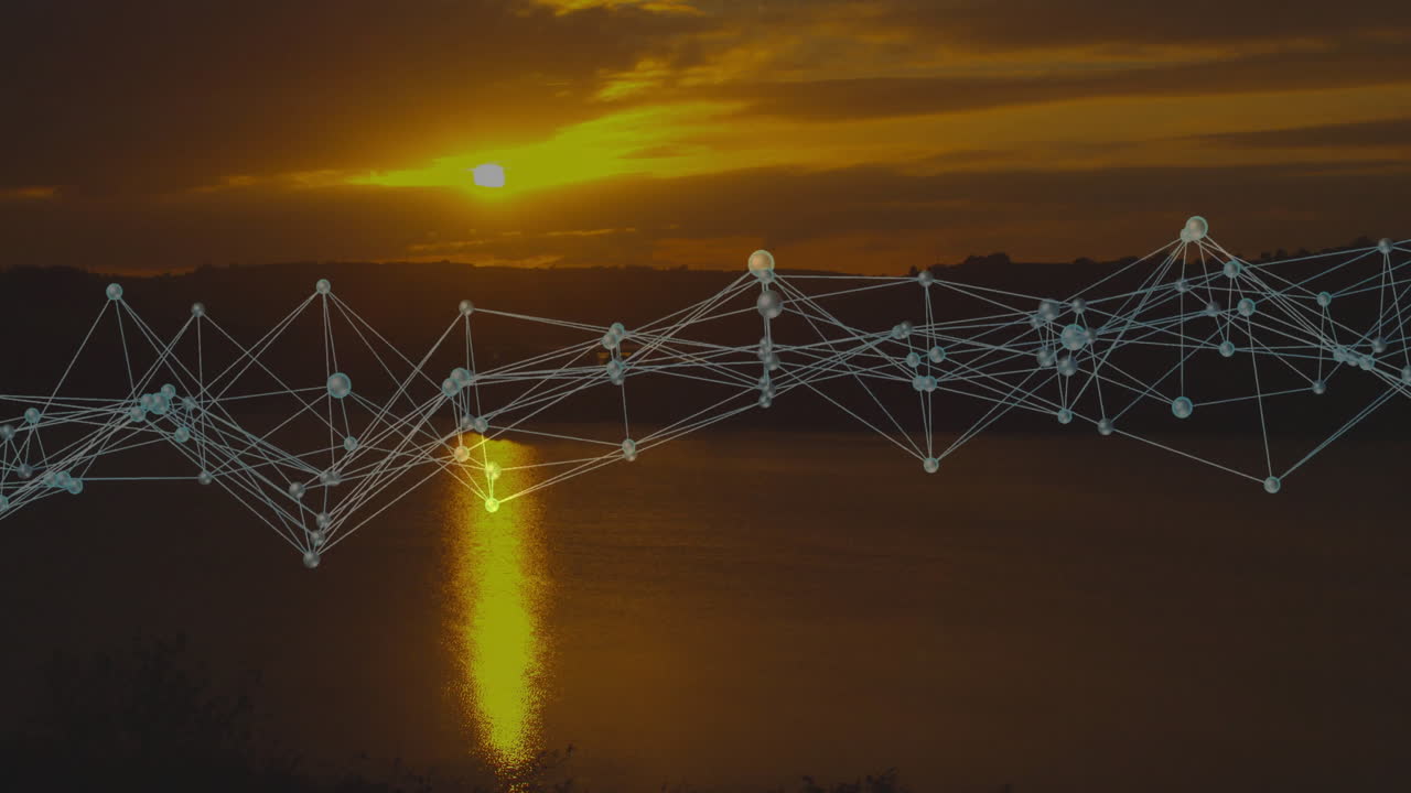 Digital network nodes stretching across lake at sunset, reflecting golden sky on water