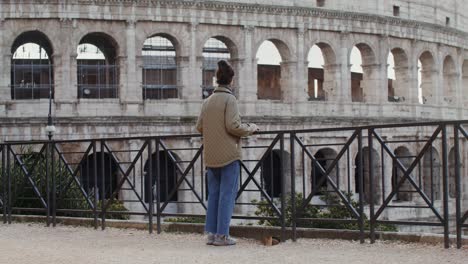 woman viewing the colosseum in rome