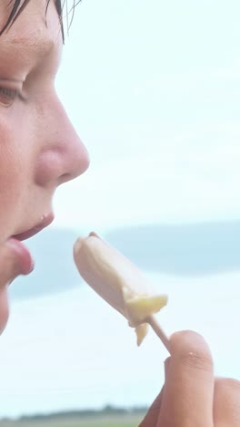 boy eating ice cream at playground
