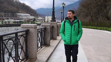 man walking in a city park