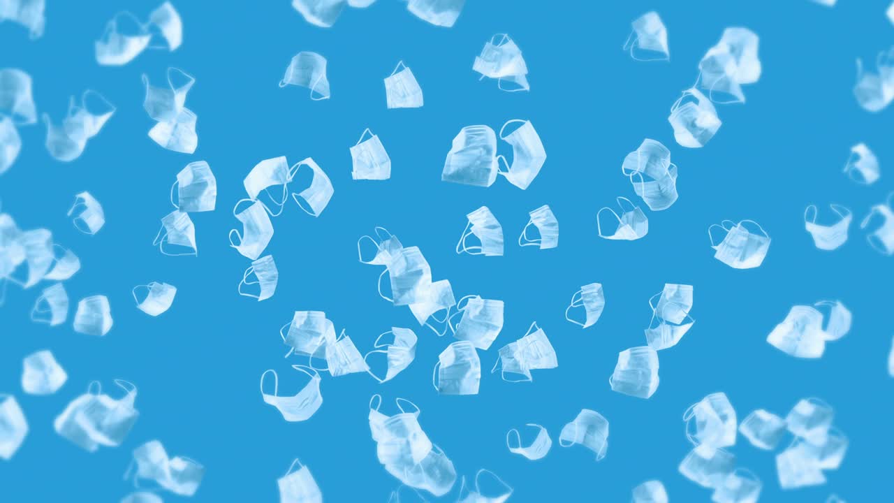 파란색 바탕에 많은 색 마스크를 날리는 의료 개념, 수술 보호 마스크, 마스크 회전의 3d 애니메이션, 루프 애니메이션.