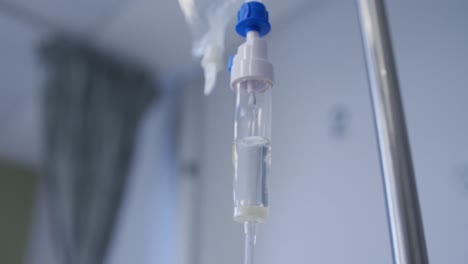 Close-up-view-of-dripping-medicine-in-drip-equipment-working-in-hospital-room