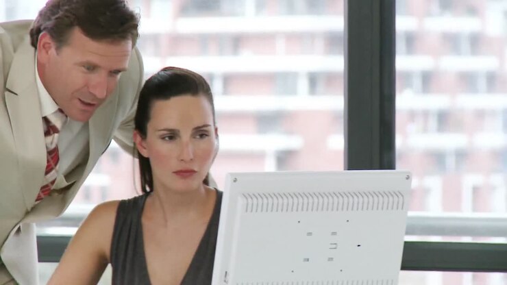 Professionally experienced businessman announces something to his associates