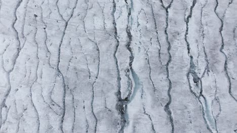 cracks on surface of fellaria of valmalenco glacier in italy