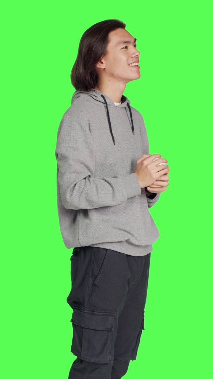 Side view of person drinking cup of coffee on camera