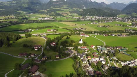 establishing aerial of small austrian town green landscape, golling an der salzach