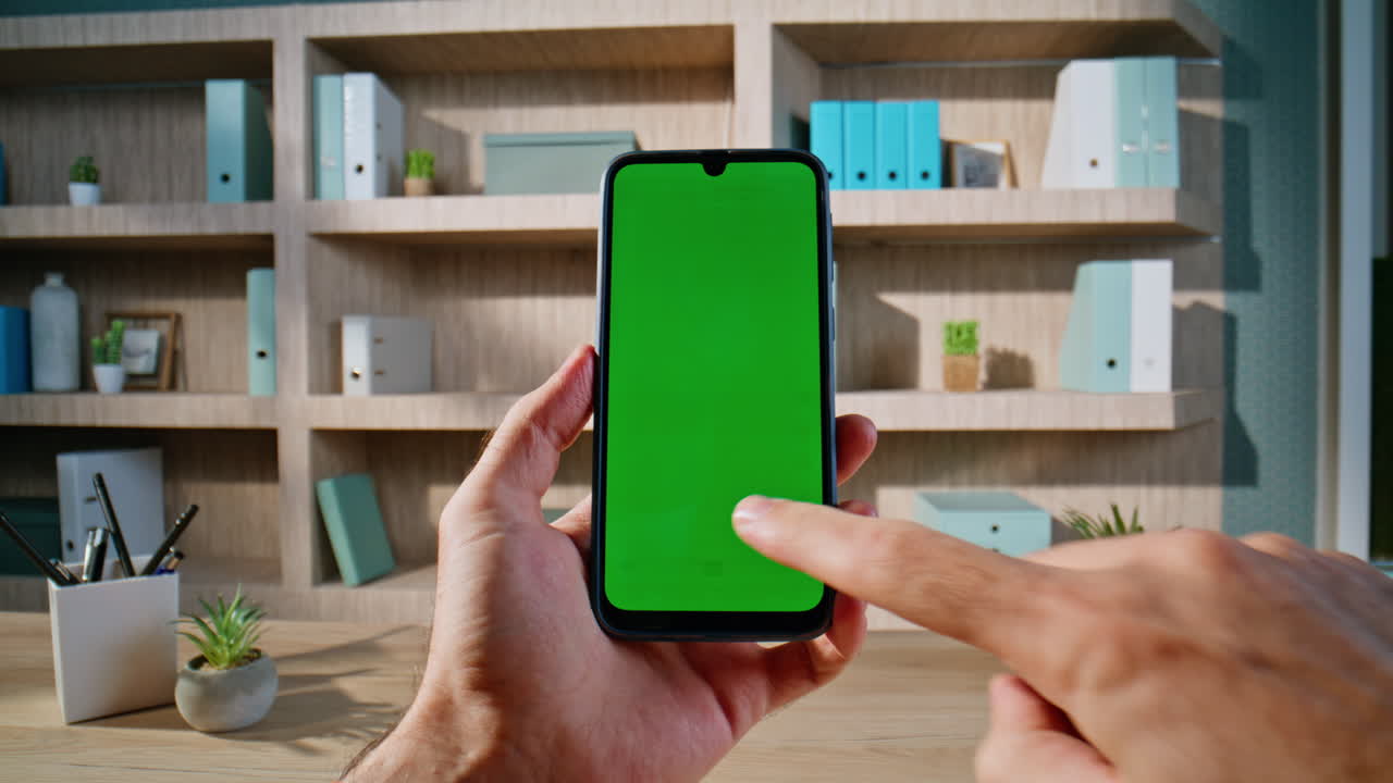 Man web surfing mockup cellphone sitting modern workplace closeup. Unknown male