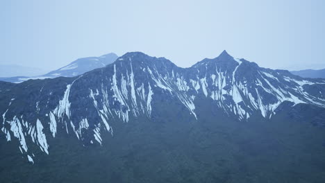 dramatic landscape of peaks of the high caucasus mountains and white snow