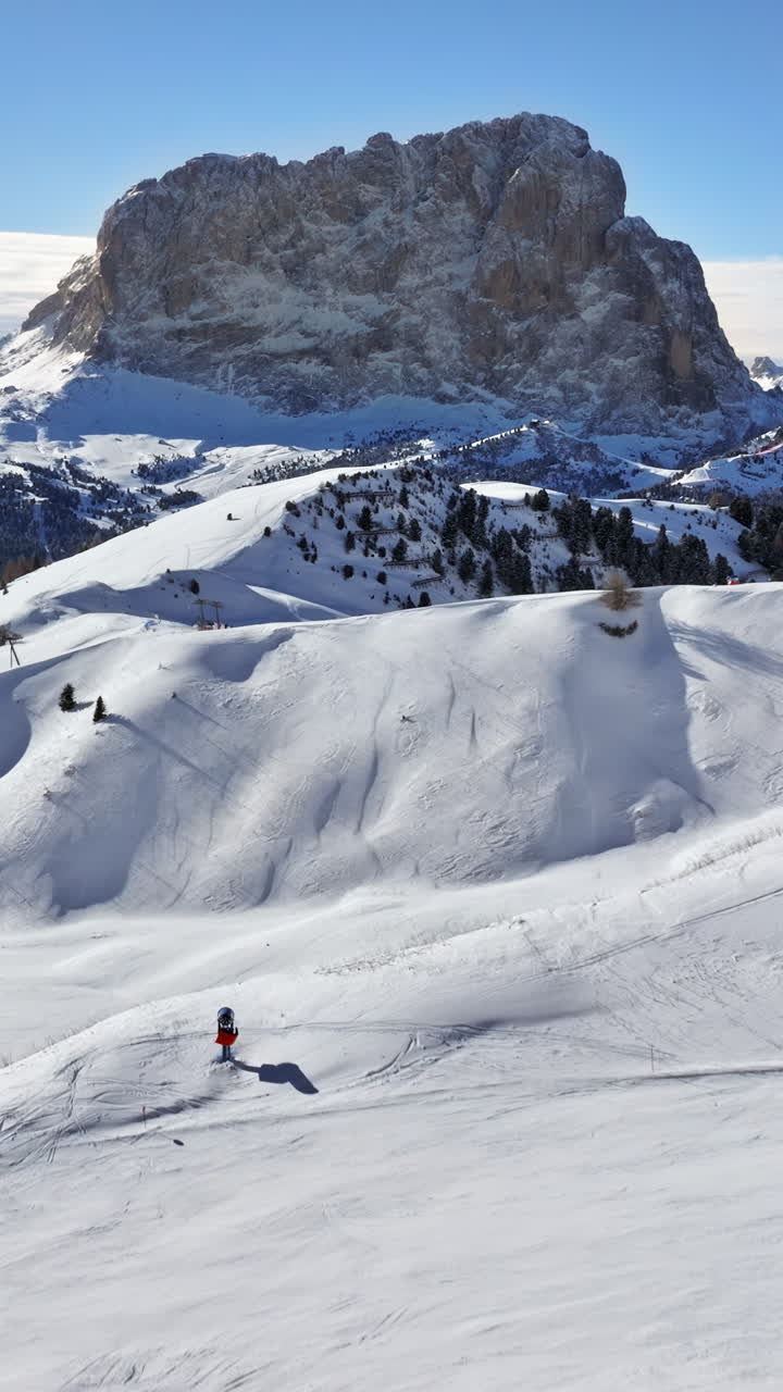 Aerial drone view of the Gardena Pass high mountain pass in the Dolomites, Italy. Vertical