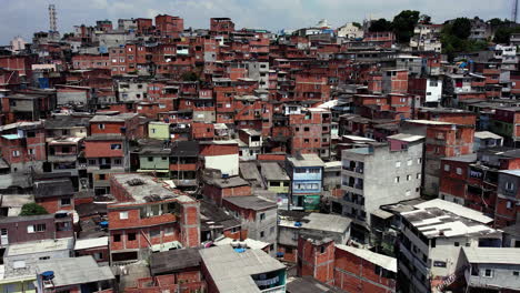 drone shot over squatter homes, sunny day in jaguare, sao paulo, brazil, south america