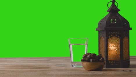 Tracking-Shot-of-Lantern-Dates-and-Water-In-Front-of-Green-Screen
