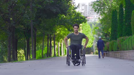 disabled man rolling away.