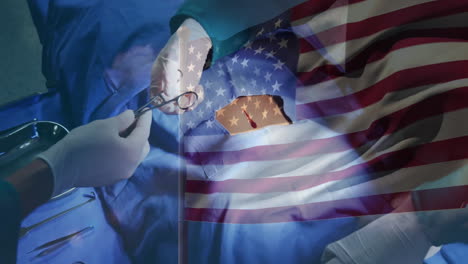 animation of flag of usa waving over surgeons in operating theatre