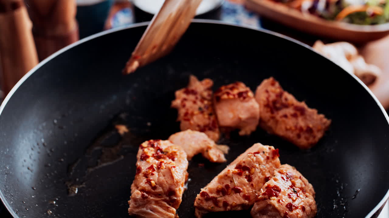 Salmon cooking in a pan