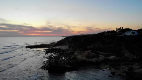 Vista-Aérea-Al-Atardecer-De-La-Playa-De-Santa-Eulalia-En-Albufeira,-Algarve