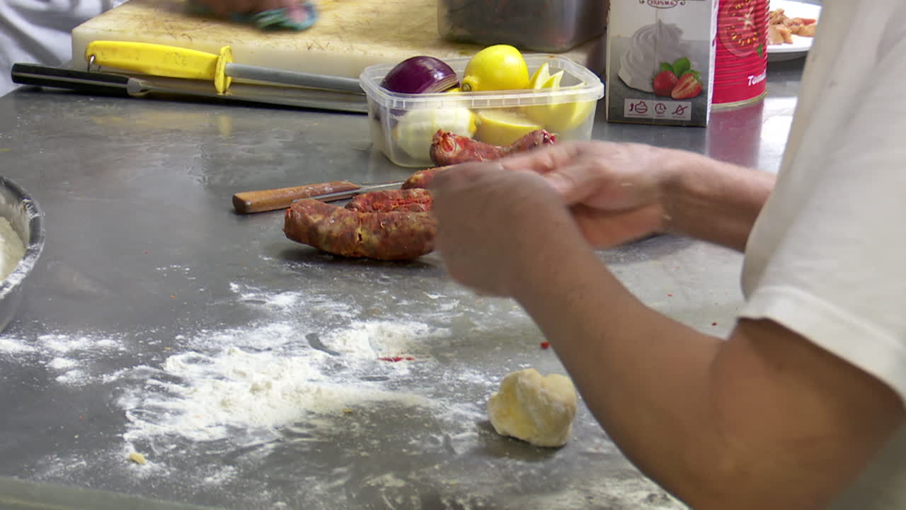 Chef Preparing Sausage and Dough